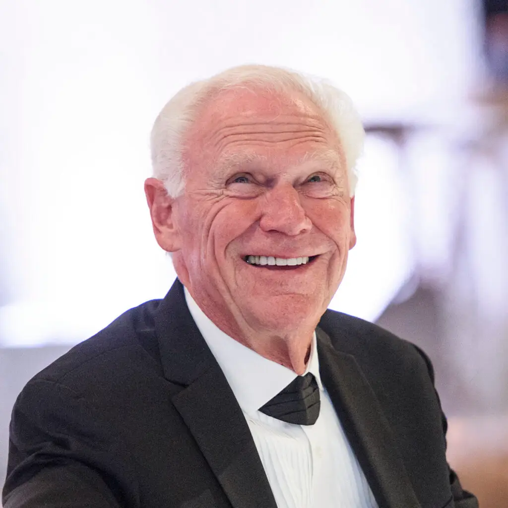 Photo of Rich Avanzino in tux looking up